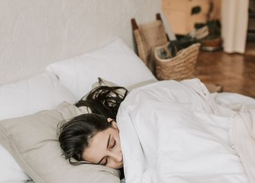 woman sleeping on bed